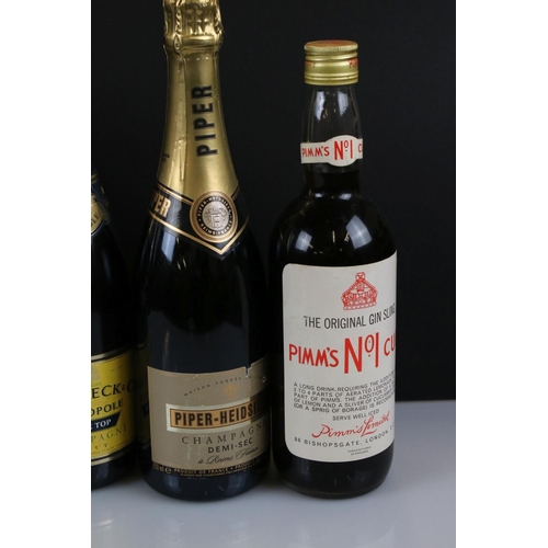 355 - A mixed collection of bottled alcohol to include Heidsieck & Co Monopole Blue Top Champagne, Pimm's ... 