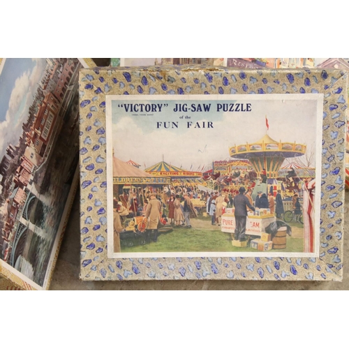 376 - A large collection of early to mid 20th century wooden Victory jigsaw puzzles.