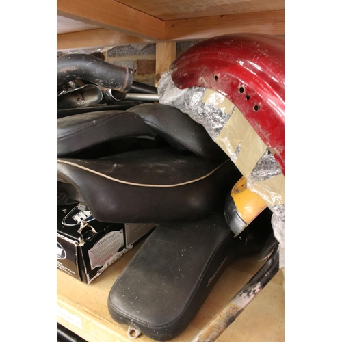 378 - A collection of used Harley Davidson & Kawasaki motorcycle parts to include seats, fenders and exhau... 