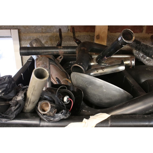 378 - A collection of used Harley Davidson & Kawasaki motorcycle parts to include seats, fenders and exhau... 