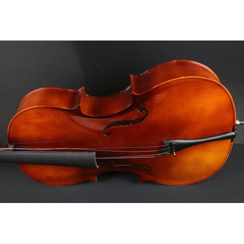 383 - A contemporary students cello with bow in black gig bag.