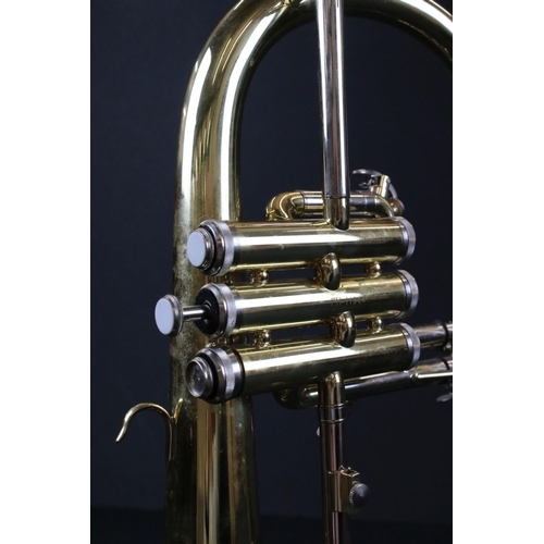 384 - A Thomann FH 600G Flugelhorn brass instrument complete with fitted case.