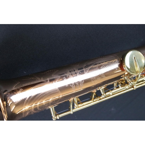 388 - A contemporary antique style Thomann TSS-350 soprano saxophone in fitted case.