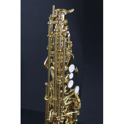 388 - A contemporary antique style Thomann TSS-350 soprano saxophone in fitted case.