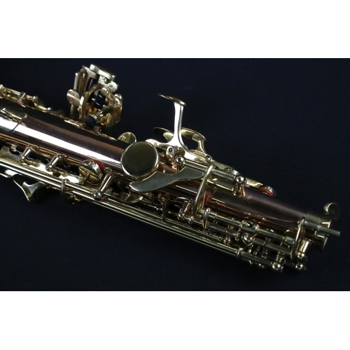 388 - A contemporary antique style Thomann TSS-350 soprano saxophone in fitted case.