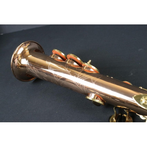 388 - A contemporary antique style Thomann TSS-350 soprano saxophone in fitted case.