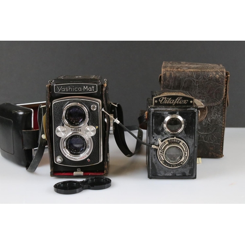 394 - A Yashica-Mat Copal MXV twin lens reflex camera together with a Vitaflex twin lens reflex camera.