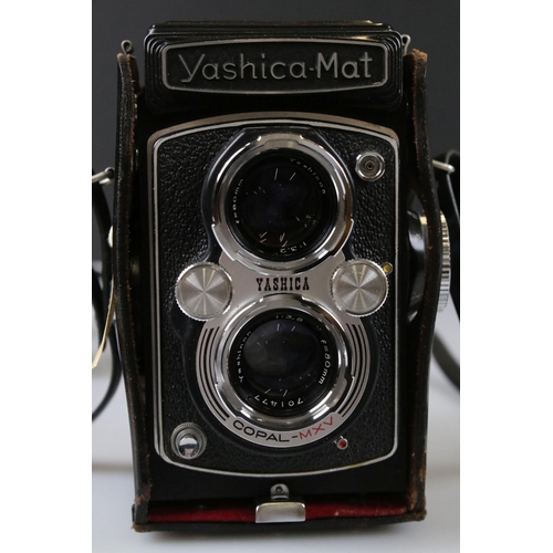 394 - A Yashica-Mat Copal MXV twin lens reflex camera together with a Vitaflex twin lens reflex camera.