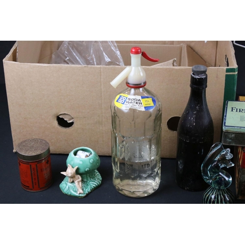 402 - A group of mixed collectables to include a soda syphon, vintage teddy bear, thimbles, advertising ti... 