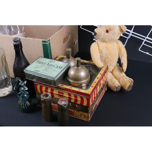 402 - A group of mixed collectables to include a soda syphon, vintage teddy bear, thimbles, advertising ti... 