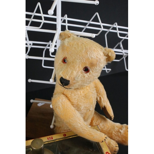 402 - A group of mixed collectables to include a soda syphon, vintage teddy bear, thimbles, advertising ti... 