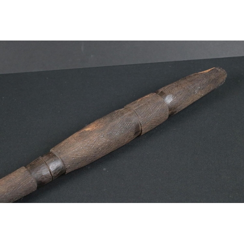 410 - A tribal spear with carved wooden handle.