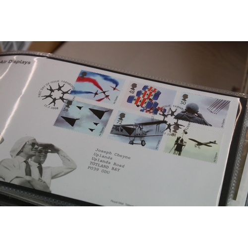 422 - A large collection of mainly British First Day covers within albums together with many loose example... 