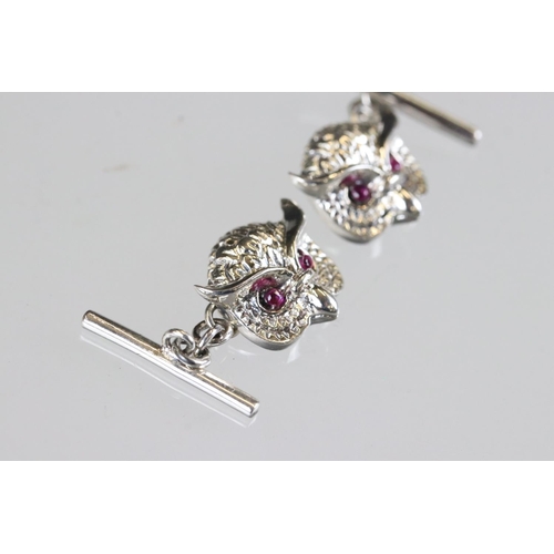 183 - Pair of silver owl shaped cufflinks with ruby eyes