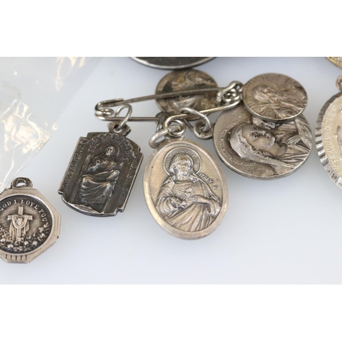 186 - Group of pendants and a stick pin etc, white metal