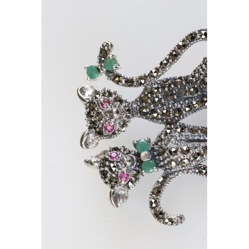 192 - Silver and marcasite cat brooch set with ruby and emeralds