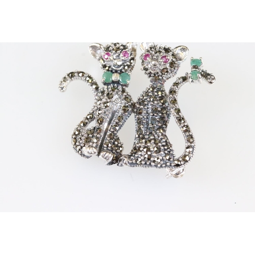 192 - Silver and marcasite cat brooch set with ruby and emeralds