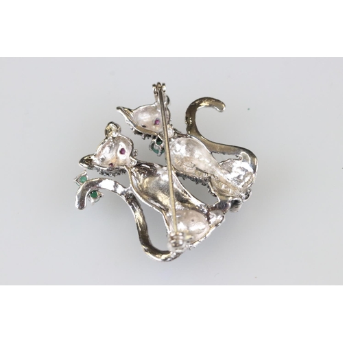 192 - Silver and marcasite cat brooch set with ruby and emeralds