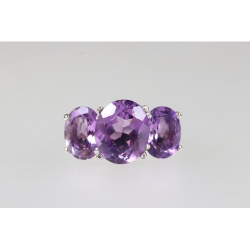 208 - Silver amethyst three stone ring