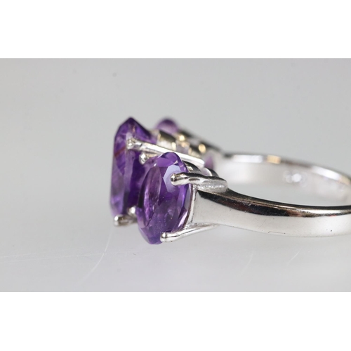 208 - Silver amethyst three stone ring