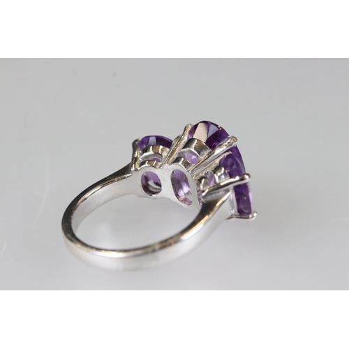 208 - Silver amethyst three stone ring