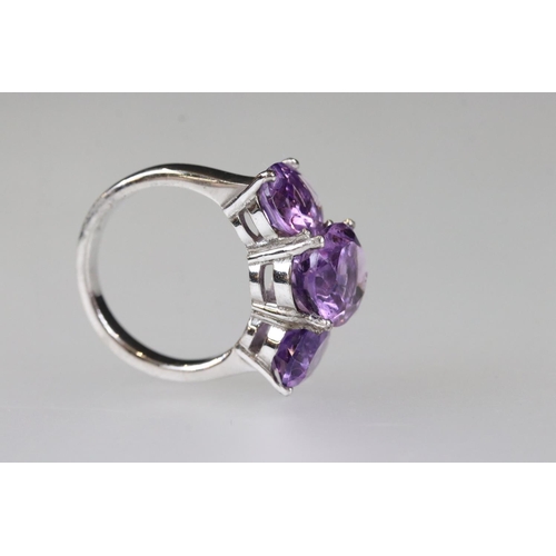 208 - Silver amethyst three stone ring