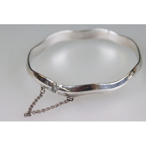 215 - Silver bamboo design bangle, Birmingham 1966, together with another silver bangle, both with safety ... 