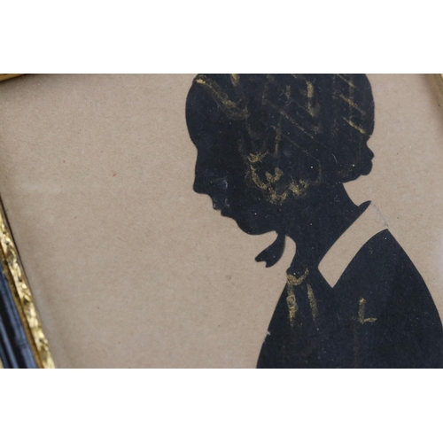 239 - Two framed and glazed silhouette portraits together with a early framed portrait photograph.