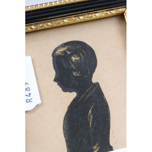 239 - Two framed and glazed silhouette portraits together with a early framed portrait photograph.