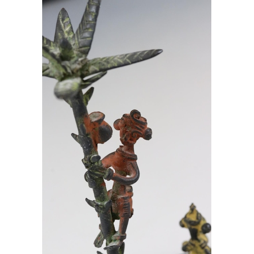 240 - A cast metal palm tree and figural ornament.