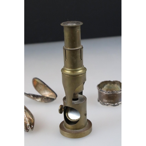 249 - A small group of mixed collectables to include a brass students microscope, a hallmarked silver napk... 