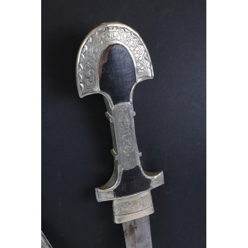 257 - White metal Persian dagger with curved blade and scabbard