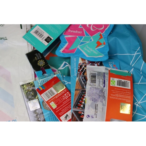 287 - A collection of London 2012 Olympic Games official products to include figures, cards, bag, relay ba... 