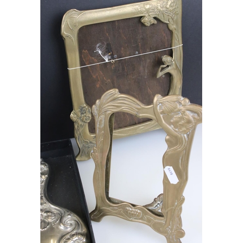 293 - A group of mixed collectables to include two brass art nouveau photograph frames, silver plated brus... 