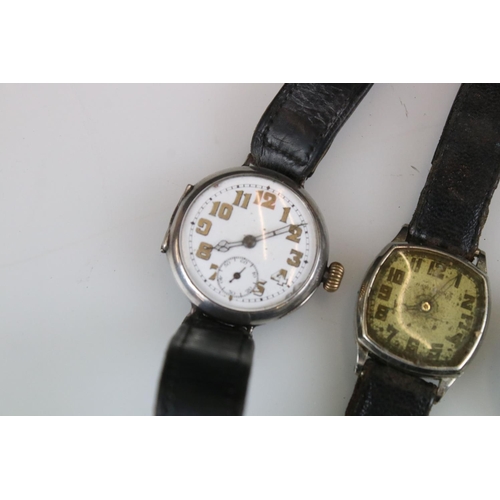 300 - Four military watches to include silver trench watches, WW2 Hamilton etc