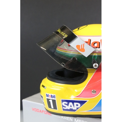 304 - A collectable half scale Vodafone McLaren Mercedes Lewis Hamilton racing helmet with original box.