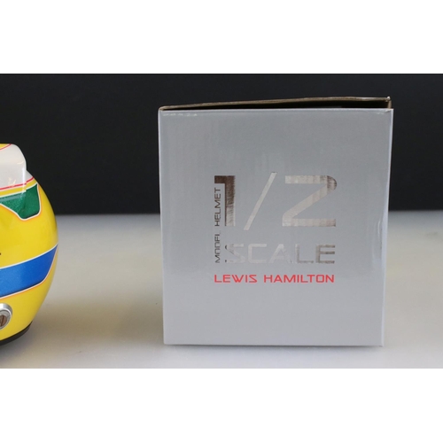 304 - A collectable half scale Vodafone McLaren Mercedes Lewis Hamilton racing helmet with original box.