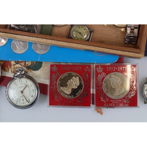 309 - A small collection of commemorative coins and medallions together with a small group of watches to i... 