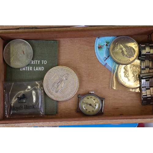 309 - A small collection of commemorative coins and medallions together with a small group of watches to i... 