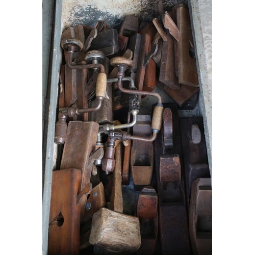 629 - Early to Mid century Metal Tool Chest containing a quantity of old tools mostly Wooden Planes plus s... 