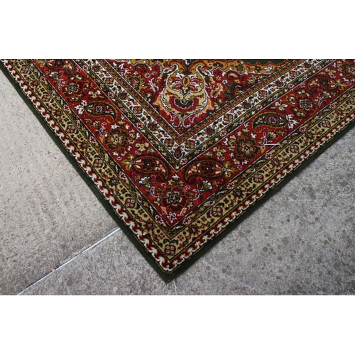 632 - Woodward Grosvenor Axminster Green Ground Rug with floral pattern, 80% wool, 366cm x 270cm