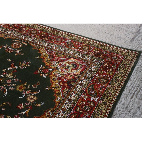 632 - Woodward Grosvenor Axminster Green Ground Rug with floral pattern, 80% wool, 366cm x 270cm