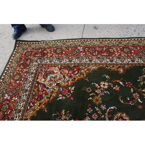 632 - Woodward Grosvenor Axminster Green Ground Rug with floral pattern, 80% wool, 366cm x 270cm