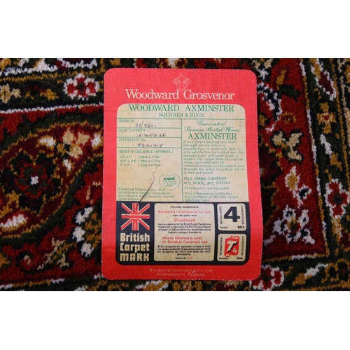 632 - Woodward Grosvenor Axminster Green Ground Rug with floral pattern, 80% wool, 366cm x 270cm