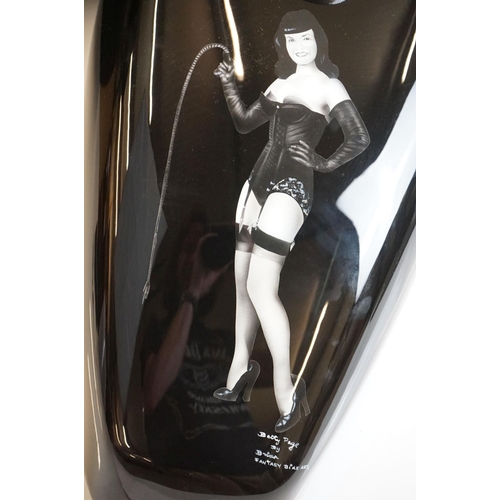 378A - A Harley Davidson Sportster petrol tank with Bettie Page decal