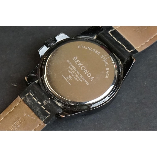 236 - A small collection of three gents watches to include Sekonda, Rotary and Fossil examples.