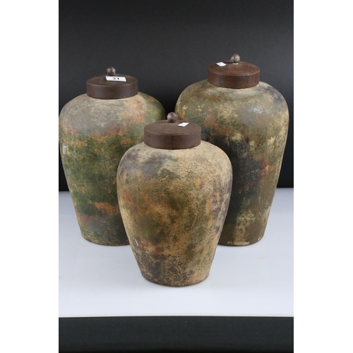 31 - Three Weathered Terracotta Urns with Metal Lids, tallest 40cm