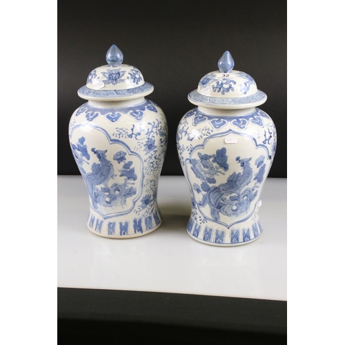 32 - Pair of 20th century Chinese Blue and White Lidded Baluster Vases, marked to base, 44cm high