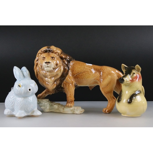 4 - Goebel Lion stood on a rocky outcrop, model 36 019 25, 47cm long together with a Novelty ' Bunny ' T... 