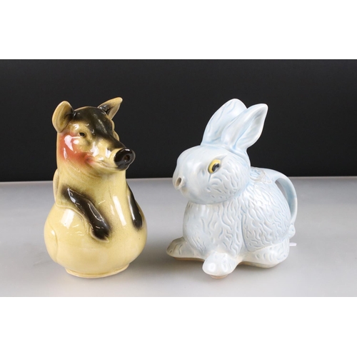 4 - Goebel Lion stood on a rocky outcrop, model 36 019 25, 47cm long together with a Novelty ' Bunny ' T... 